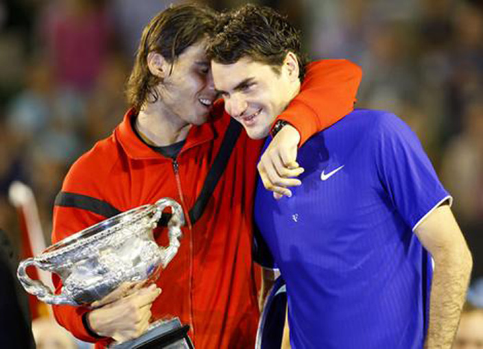 Spain's Rafael Nadal, left, hugs Switzerland's Roger Federer during the award ceremony after winning the Men'sfinal match at the Australian Open.