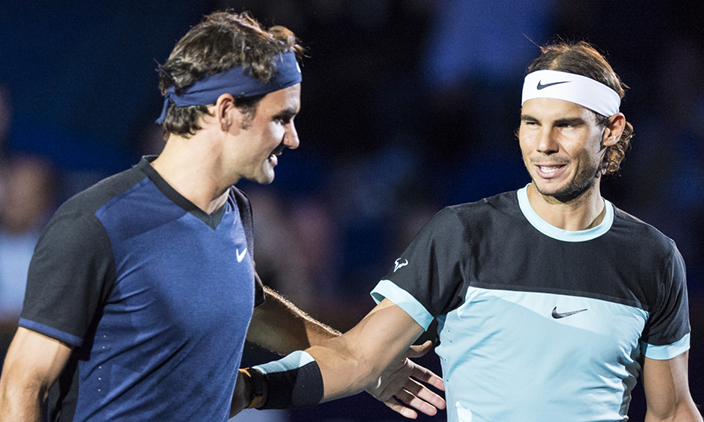 Switzerland's Roger Federer, left, and Spain's Rafael Nadal, right, share a word before their final match at the Swiss Indoors tennis tournament at the St. Jakobshalle in Basel, Switzerland, Sunday, Nov. 1, 2015. (Dominic Steinmann/Keystone via AP) ORG XMIT: BAS101