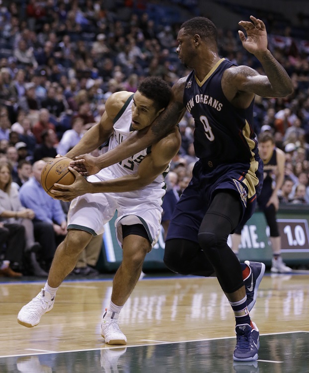 Milwaukee Bucks' Malcolm Brogdon, left, drives against New Orleans Pelicans' Terrence Jones during the second half of an NBA basketball game Thursday, Nov. 10, 2016, in Milwaukee. (AP Photo/Jeffrey Phelps)