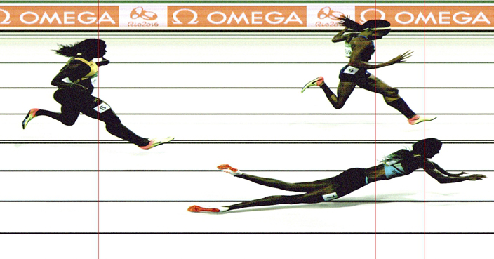 The image provided by OMEGA on Monday, Aug. 15, 2016 shows the photo finish of the women's 400-meter final when Bahamas' Shaunae Miller, bottom right, falls over the finish line to win gold ahead of United States' silver medal winner Allyson Felix, top right, and Jamaica's bronze medal winner Shericka Jackson, left,  during the athletics competitions of 2016 Summer Olympics at the Olympic stadium in Rio de Janeiro, Brazil, Monday evening, Aug, 1