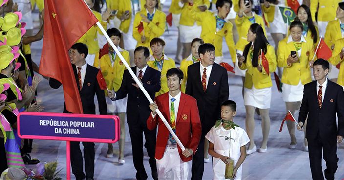 Lei Sheng carries the flag of China during the opening ceremony for the 2016 Summer Olympics in Rio de Janeiro, Brazil, Friday, Aug. 5, 2016. (AP Photo/Michael Sohn)