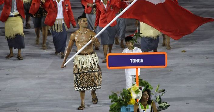 Pita Nikolas Aufatofua carries the flag of Tonga during the opening ceremony for the 2016 Summer Olympics in Rio de Janeiro, Brazil, Friday, Aug. 5, 2016. (AP Photo/Matt Slocum)