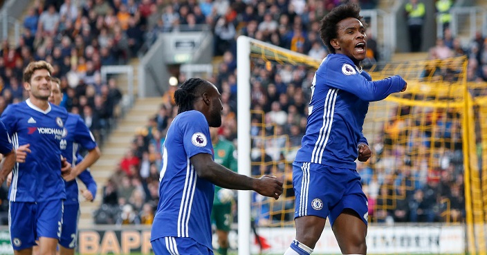 Chelsea's Willian, right, celebrates scoring his side's first goal of the game during their English Premier League soccer match against Hull City at the KCOM Stadium, Hull, England, Saturday, Oct. 1, 2016. (Danny Lawson/PA via AP)