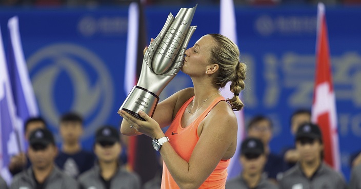 Petra Kvitova of the Czech Republic kisses the trophy after winning the women's singles final at the WTA Wuhan Open in Wuhan in central China's Hubei province Saturday, Oct. 1, 2016. (Chinatopix via AP)