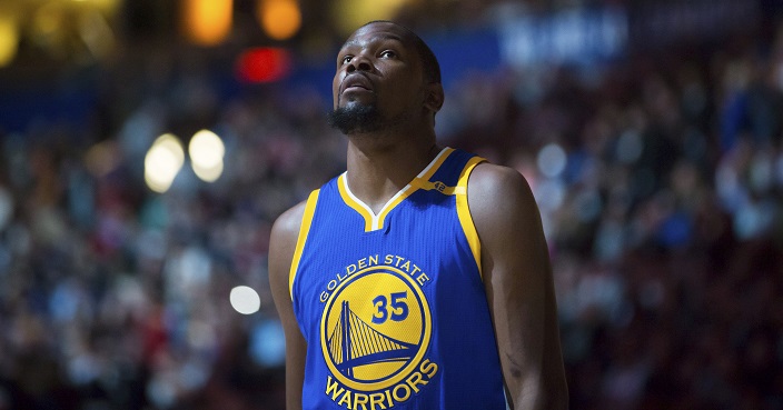 Golden State Warriors' Kevin Durant looks on before a preseason NBA basketball game against the Toronto Raptors, in Vancouver, British Columbia, Saturday Oct. 1, 2016. (Darryl Dyck/The Canadian Press via AP)