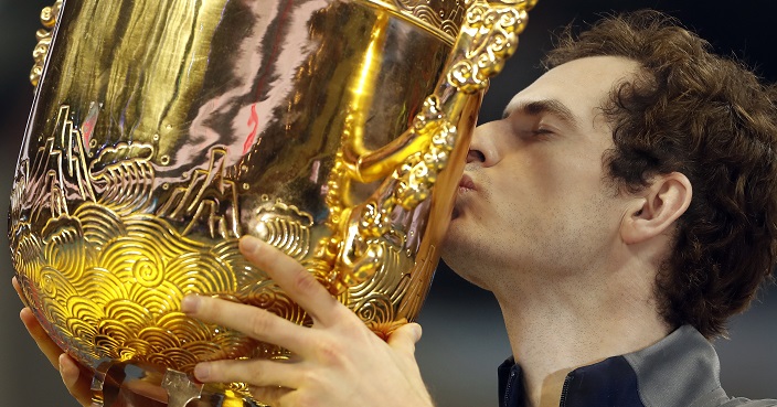 Andy Murray of Britain kisses his winner's trophy after defeating Gregor Dimitrov of Bulgaria in the men's singles final match at the China Open tennis tournament in Beijing, Sunday, Oct. 9, 2016. (AP Photo/Andy Wong)