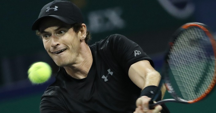 Andy Murray of Britain hits a return shot against Steve Johnson of the United States during the men's singles match of the Shanghai Masters tennis tournament at Qizhong Forest Sports City Tennis Center in Shanghai, China, Wednesday, Oct. 12, 2016. (AP Photo/Andy Wong)