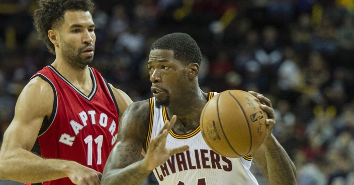 Cleveland Cavaliers' DeAndre Liggins (14) drives against Toronto Raptors' Drew Crawford (11) during the first half of an NBA preseason basketball game in Cleveland, Thursday, Oct. 13, 2016. (AP Photo/Phil Long)