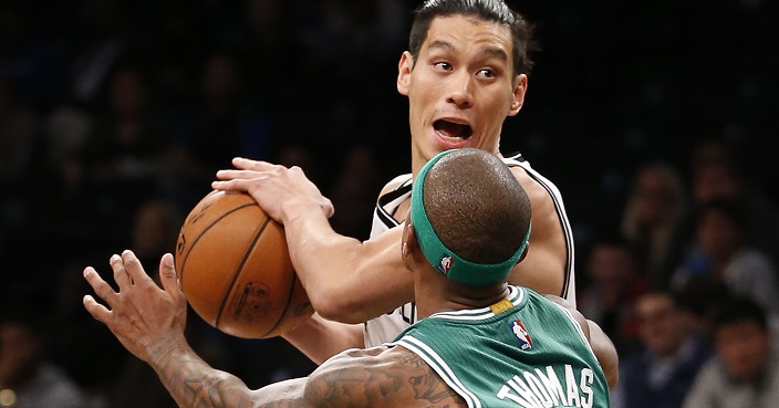 Brooklyn Nets guard Jeremy Lin, top, looks to pass around Boston Celtics guard Isaiah Thomas (4) in the first half of a preseason NBA basketball game, Thursday, Oct. 13, 2016, in New York. (AP Photo/Kathy Willens)