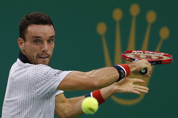 Roberto Bautista Agut of Spain hits a return shot against Andy Murray of Britain during the men's singles final of the Shanghai Masters tennis tournament at Qizhong Forest Sports City Tennis Center in Shanghai, China, Sunday, Oct. 16, 2016. (AP Photo/Andy Wong)