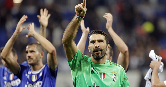 Juventus goalkeeper Gianluigi Buffon celebrates after the Champions League Group H soccer match against Lyon, Tuesday Oct. 18, 2016, in Lyon, central France. (AP Photo/Laurent Cipriani)