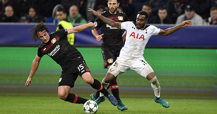 Leverkusen's Julian Baumgartlinger, left, and Tottenham's Danny Rose fight for the ball during the Champions League group E soccer match between Bayer Leverkusen and Tottenham Hotspur in Leverkusen, Germany, Tuesday, Oct. 18, 2016. (AP Photo/Martin Meissner)