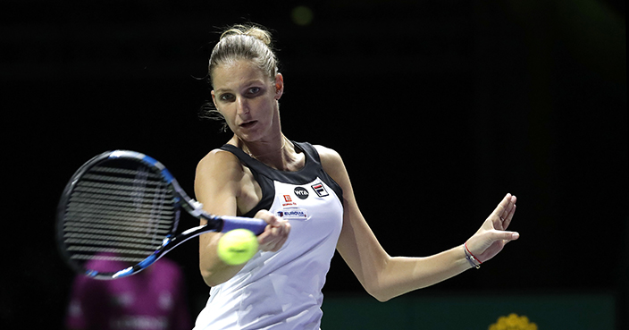 Karolina Pliskova, of the Czech Republic makes a forehand return against Garbine Muguruza of Spain during their singles match at the WTA tennis tournament in Singapore, Monday, Oct. 24, 2016. (AP Photo/Wong Maye-E)