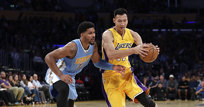 Los Angeles Lakers' Yi Jianlian, right, of China, is pressured by Denver Nuggets' Jarnell Stokes during the second half of an NBA preseason basketball game, Friday, Oct. 7, 2016, in Los Angeles. The Nuggets won 101-97. (AP Photo/Jae C. Hong)