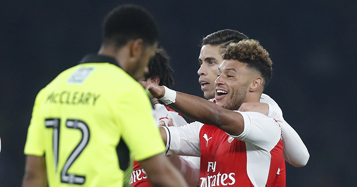 Arsenal's Alex Oxlade-Chamberlain, right, celebrates scoring a goal during the English League Cup soccer match between Arsenal and Reading at Emirates stadium in London, Tuesday, Oct. 25, 2016. (AP Photo/Kirsty Wigglesworth)