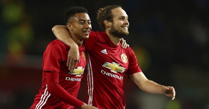 Manchester United's Jesse Lingard, left, and Manchester United's Daley Blind smile after their team won the English League Cup soccer match between Manchester United and Manchester City at Old Trafford stadium in Manchester, England, Wednesday, Oct. 26, 2016. (AP Photo/Dave Thompson)