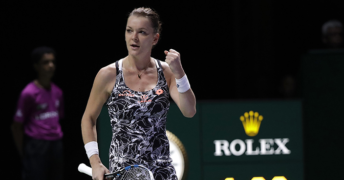 Agnieszka Radwanska of Poland celebrates after beating Garbine Muguruza of Spain during their singles match at the WTA tennis tournament in Singapore, Thursday, Oct. 27, 2016. (AP Photo/Wong Maye-E)