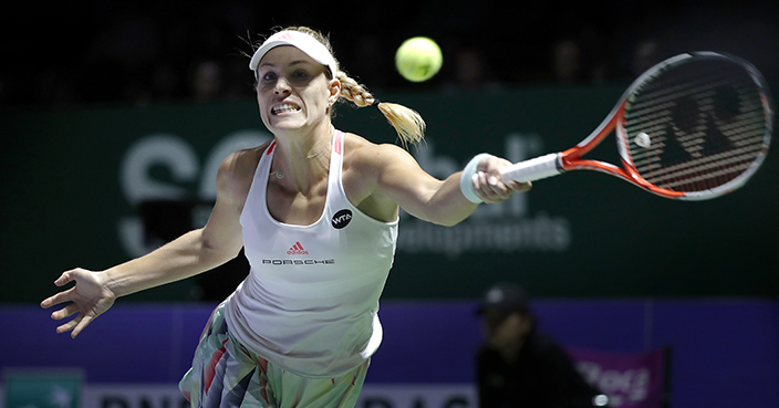 Angelique Kerber of Germany make a forehand return against Madison Keys of the United States during their singles match at the WTA tennis tournament in Singapore, Thursday, Oct. 27, 2016. (AP Photo/Wong Maye-E)