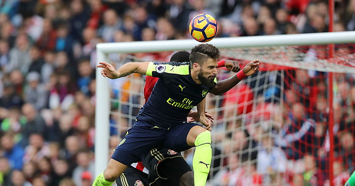 Arsenal's Olivier Giroud, front, heads the ball to score his side's third goal of the game during their English Premier League soccer match against Sunderland at the Stadium of Light, Sunderland, England, Saturday, Oct. 29, 2016. (Owen Humphreys/PA via AP)