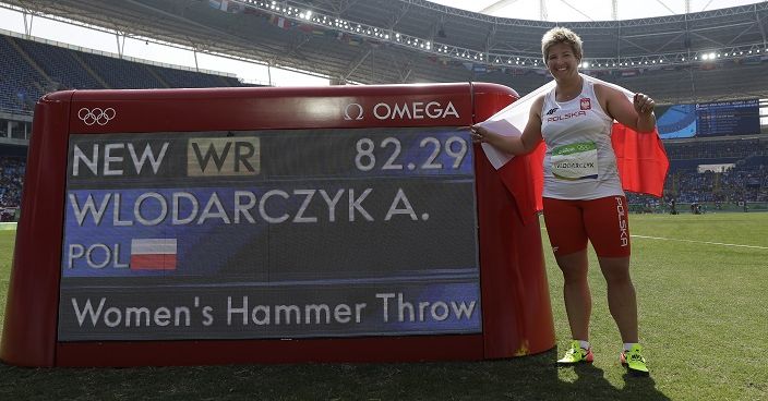 Poland's Anita Wlodarczyk celebrates after winning the gold medal and setting a new world record in the women's hammer throw final during the athletics competitions of the 2016 Summer Olympics at the Olympic stadium in Rio de Janeiro, Brazil, Monday, Aug. 15, 2016. (AP Photo/Matt Dunham)