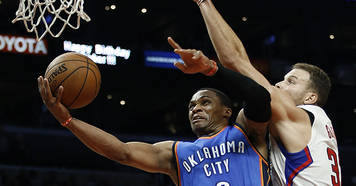 Oklahoma City Thunder guard Russell Westbrook (0) shoots against Los Angeles Clippers forward Blake Griffin (32) during the second half of an NBA basketball game in Los Angeles, Wednesday, Nov. 2, 2016. The Thunder won 85-83. (AP Photo/Alex Gallardo)