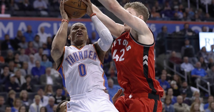 Oklahoma City Thunder guard Russell Westbrook (0) goes up for a shot in front of Toronto Raptors center Jakob Poeltl (42) during the second half of an NBA basketball game in Oklahoma City, Wednesday, Nov. 9, 2016. Toronto won 112-102. (AP Photo/Alonzo Adams)
