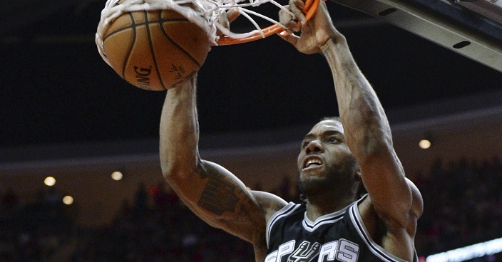 San Antonio Spurs forward Kawhi Leonard (2) dunks against the Houston Rockets in the second half of an NBA basketball game on Saturday, Nov. 12, 2016, in Houston. San Antonio won the game 106-100. (AP Photo/George Bridges)
