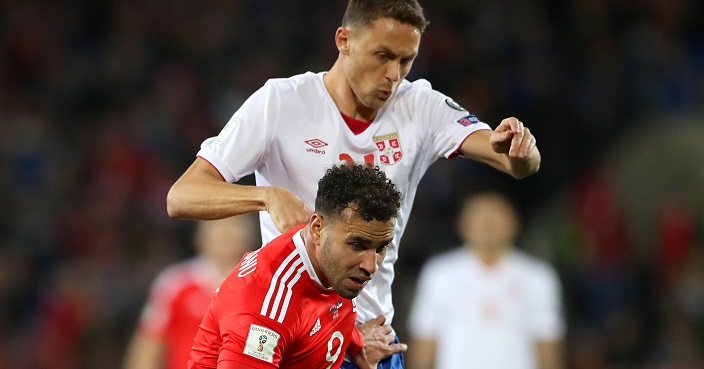 Wales' Hal Robson-Kanu, foreground and Serbia's Nemanja Matic battle for the ball, during the 2018 World Cup Group D qualifying soccer match between Wales and Serbia,  at the Cardiff City Stadium in Cardiff, Wales, Saturday, Nov. 12, 2016. (Nick Potts/PA via AP)