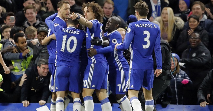 Chelsea's Victor Moses, centre partially obscured, celebrates with teammates after scoring their second goal during the English Premier League soccer match between Chelsea and Tottenham Hotspur at Stamford Bridge stadium in London, Saturday, Nov. 26, 2016.(AP Photo/Frank Augstein)