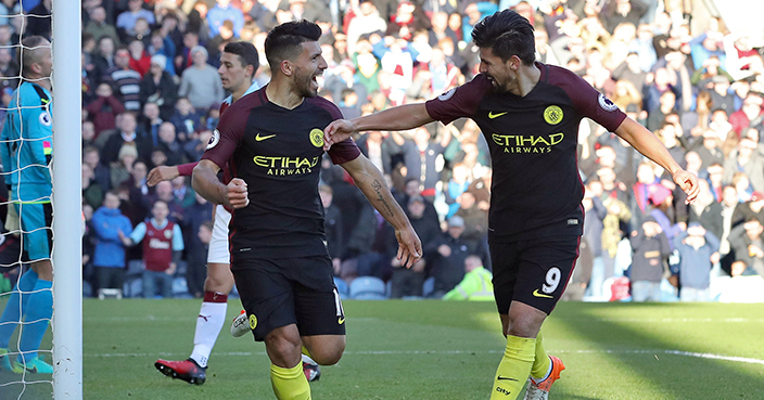 Manchester City's Sergio Aguero, left, celebrates with teammate Nolito after scoring against Burnley during the English Premier League soccer match at Turf Moor, Burnley, England, Saturday Nov. 26, 2016. (Martin Rickett/PA via AP)