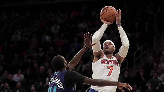 New York Knicks forward Carmelo Anthony (7) shoots against Charlotte Hornets forward Michael Kidd-Gilchrist (14) in overtime of an NBA basketball game, Friday, Nov. 25, 2016, in New York. The Knicks won 113-111. (AP Photo/Julie Jacobson)