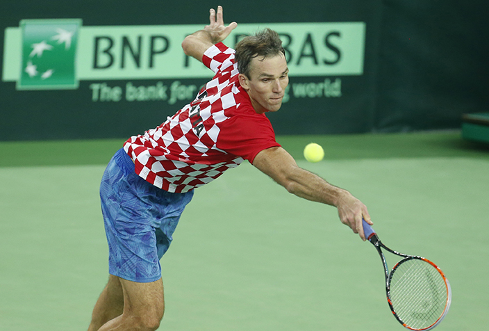 Croatia's Ivo Karlovic returns to Argentina's Federico Delbonis during their Davis Cup finals tennis singles match in Zagreb, Croatia, Sunday, Nov. 27, 2016. (AP Photo/Darko Bandic)