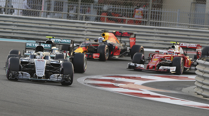 Mercedes driver Lewis Hamilton of Britain, left, steers through a corner during the Emirates Formula One Grand Prix at the Yas Marina racetrack in Abu Dhabi, United Arab Emirates, Sunday, Nov. 27, 2016. (AP Photo/Kamran Jebreili)