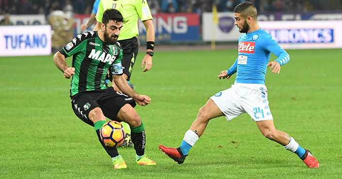 Napoli's Lorenzo Insigne, right, and Sassuolo's Francesco Magnanelli, vie for the ball during an Italian Serie A soccer match between Napoli and Sassuolo at San Paolo stadium in Naples, Monday, Nov. 28, 2016. (Ciro Fusco/ANSA via AP)