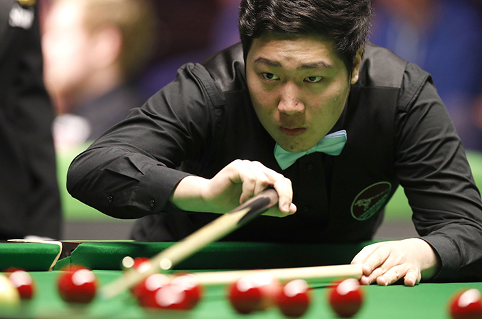 China's Yan Bingtao in action against Zhou Yuelong, during day six of the UK Championships 2016, at the Barbican in York, England, Monday Nov. 28, 2016. (Martin Rickett / PA via AP)