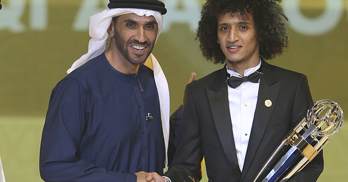 Emirati football player Omar Abdulrahman, right, poses with the AFC player of year trophy next to Sheikh Nahyan bin Zayed Al Nahyan, the Chairman of Abu Dhabi Sports Council, at the Emirates Palace in Abu Dhabi, United Arab Emirates, Thursday, Dec. 1, 2016. (AP Photo/Kamran Jebreili)