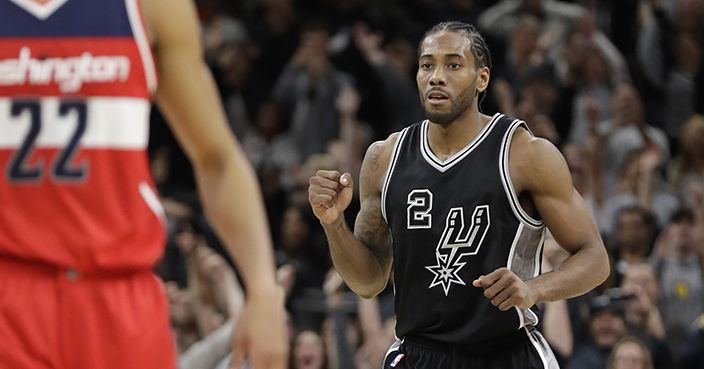 San Antonio Spurs forward Kawhi Leonard (2) pumps his fist after hitting the winning score against the Washington Wizards during the second half of an NBA basketball game, Friday, Dec. 2, 2016, in San Antonio. San Antonio won 107-105. (AP Photo/Eric Gay)