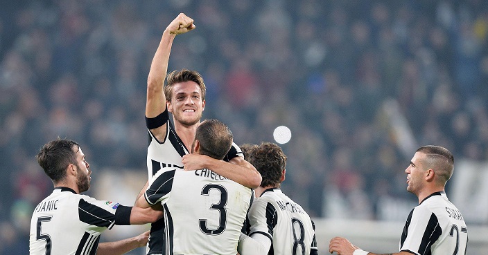 Juventus' Daniele Rugani, center top, celebrates after scoring during a Serie A soccer match between Juventus and Atalanta, at the Juventus Stadium in Turin, Italy, Saturday, Dec. 3, 2016. (Alessandro Di Marco/ANSA via AP)