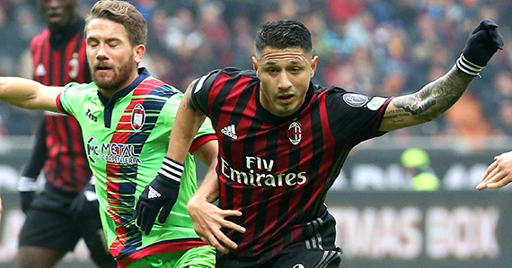 Crotone's Marcus Rohden, left, challenges for the ball with AC Milan forward Gianluca Lapadula during their Serie A soccer match at the San Siro stadium in Milan, Italy, Sunday, Dec. 4, 2016. (Matteo Bazzi/ANSA via AP)
