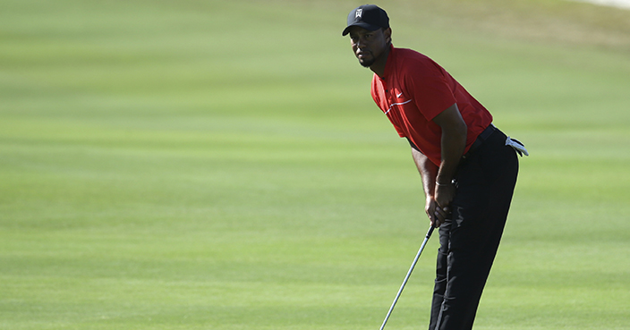 Tiger Woods watches his shot from the 14th fairway during the final round at the Hero World Challenge golf tournament, Sunday, Dec. 4, 2016, in Nassau, Bahamas. (AP Photo/Lynne Sladky)