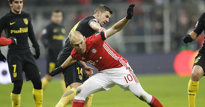 Bayern's Arjen Robben, center right, fights for the ball with Atletico's Gabi, center left, during the Champions League Group D soccer match between FC Bayern Munich and Atletico Madrid in Munich, Germany, Tuesday, Dec. 6, 2016. (AP Photo/Matthias Schrader)