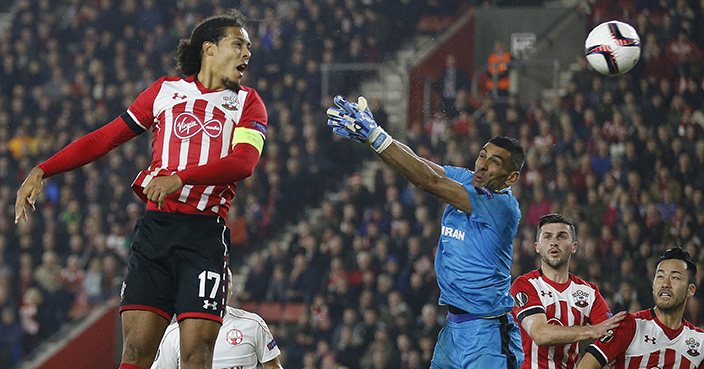 Southampton's Virgil van Dijk, left heads the ball but fails to score during the Europa League group K soccer match between Southampton and Hapoel Be'er Sheva at St Mary's stadium in Southampton, England, Thursday, Dec. 8, 2016 . (AP Photo/Frank Augstein)