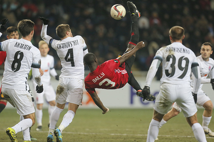 Manchester United's Eric Bailly, centre, in action with Zorya's players during the Europa League group A soccer match between Manchester United and Zorya Luhansk at Chornomorets stadium in Odessa, Ukraine, Thursday, Dec. 8, 2016. (AP Photo (AP Photo/Efrem Lukatsky)
