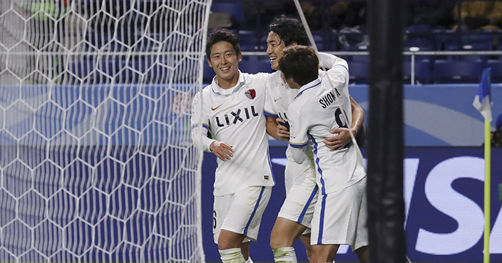 Kashima Antlers' Mu Kanazaki, center, celebrates with his teammates after he scored a goal against Mamelodi Sundowns during their match at the FIFA Club World Cup soccer tournament at Suita City Football Stadium in Suita, west Japan, Sunday, Dec. 11, 2016. (AP Photo/Eugene Hoshiko)
