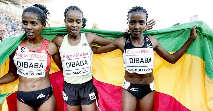 Tirunesh Dibaba of Ethiopia (R) poses with her sisters Genzebe (L) and Ejegayehu (C) after  setingt a new world record in the women's 5000m Golden League event at Bislett stadium in Oslo on June 6, 2008. The 22-year-old reigning two-time world 10,000m champion, running at the second of the six-meet Golden League series, finished in 14min 11.15sec, smashing the previous record of 14:16.63 set by compatriot Meseret Defar at last year's Bislett Games in Oslo. AFP PHOTO / Stian Lysberg Solum/ scanpix