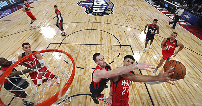 World guard Jamal Murray (27) of the Denver Nuggets goes to the basket against U.S. center Frank Kaminsky of the Charlotte Hornets during the Rising Stars Challenge, part of the NBA All-Star events in New Orleans, Friday, Feb. 17, 2017. (Ronald Martinez/Pool Photo via AP)