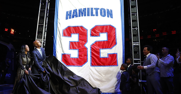 Former Detroit Pistons player Richard Hamilton unveils a banner with his jersey number to be retired during a halftime ceremony at an NBA basketball game against the Boston Celtics in Auburn Hills, Mich., Sunday, Feb. 26, 2017. (AP Photo/Paul Sancya)