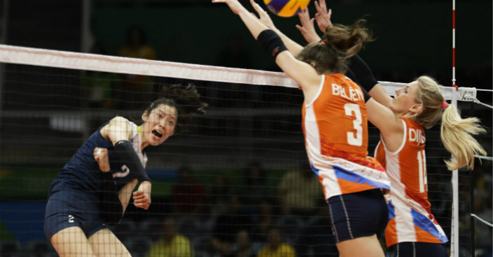China's Zhu Ting (2) hits the ball past Netherlands' Yvon Belien (3) and Laura Dijkema (14) during a women's preliminary volleyball match at the 2016 Summer Olympics in Rio de Janeiro, Brazil, Saturday, Aug. 6, 2016. (AP Photo/Matt Rourke)
