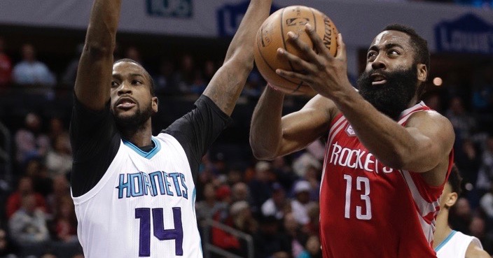 Houston Rockets' James Harden (13) drives past Charlotte Hornets' Michael Kidd-Gilchrist (14) during the second half of an NBA basketball game in Charlotte, N.C., Thursday, Feb. 9, 2017. The Rockets won 107-95. (AP Photo/Chuck Burton)