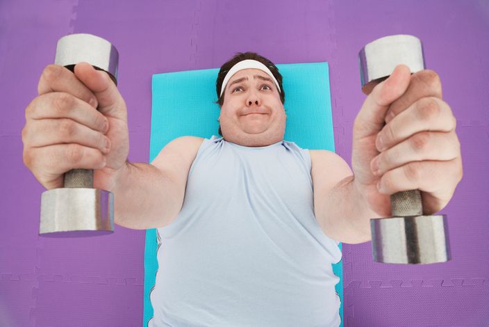 Overweight Man Lifting Weights